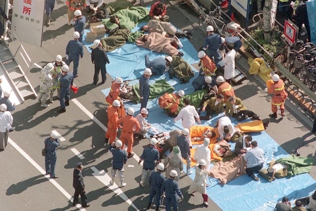 Subway passengers affected by sarin nerve gas are treated near Tsukiji station in Tokyo in this 1995 file photo. Photo: Kyodo News via AP