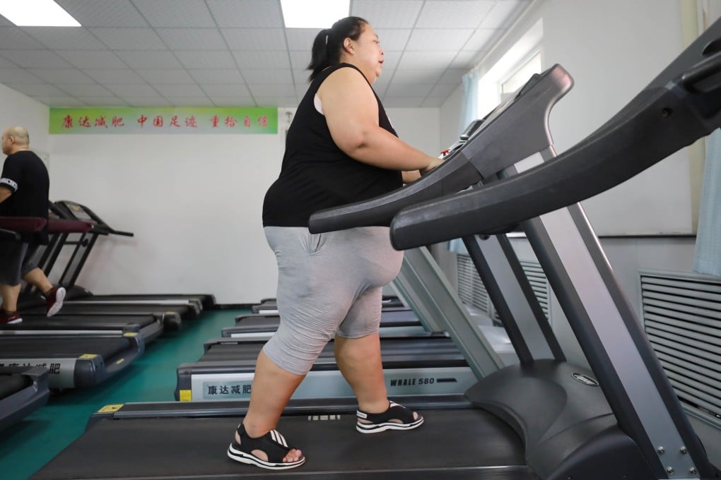 An overweight woman exercises at a weight loss clinic in Changchun, Jilin province, China. A new study has revealed that cholesterol levels are on the rise in Asia, but a healthy diet and exercise can still combat it. Photo: AFP