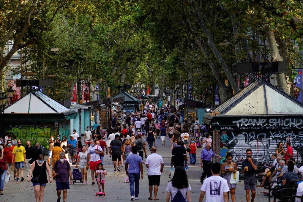 People stroll along the iconic Las Ramblas boulevard in downtown Barcelona, northeastern Spain. Photo: EPA-EFE