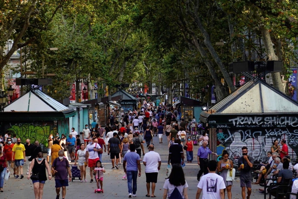 People stroll along the iconic Las Ramblas boulevard in downtown Barcelona, northeastern Spain. Photo: EPA-EFE