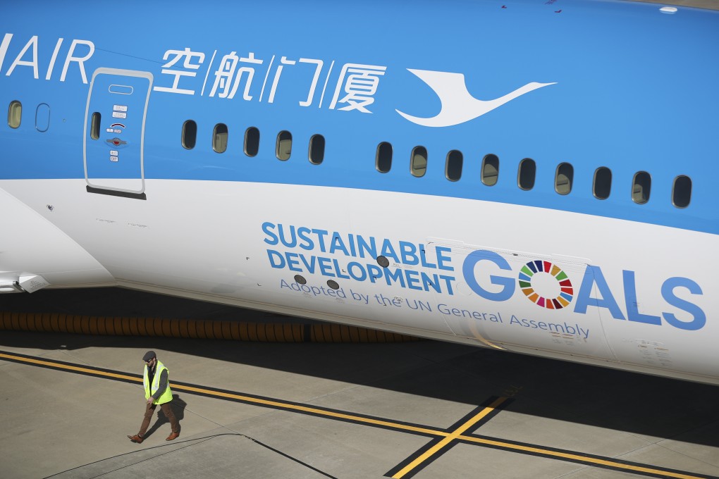 A Xiamen Airlines aircraft bearing the UN Sustainable Development Goals logo sits on the tarmac in Charleston, South Carolina, in January 2018. If market capitalism cannot get its act together to save lives and the planet, could state capitalism provide a way forward? Photo: Xinhua