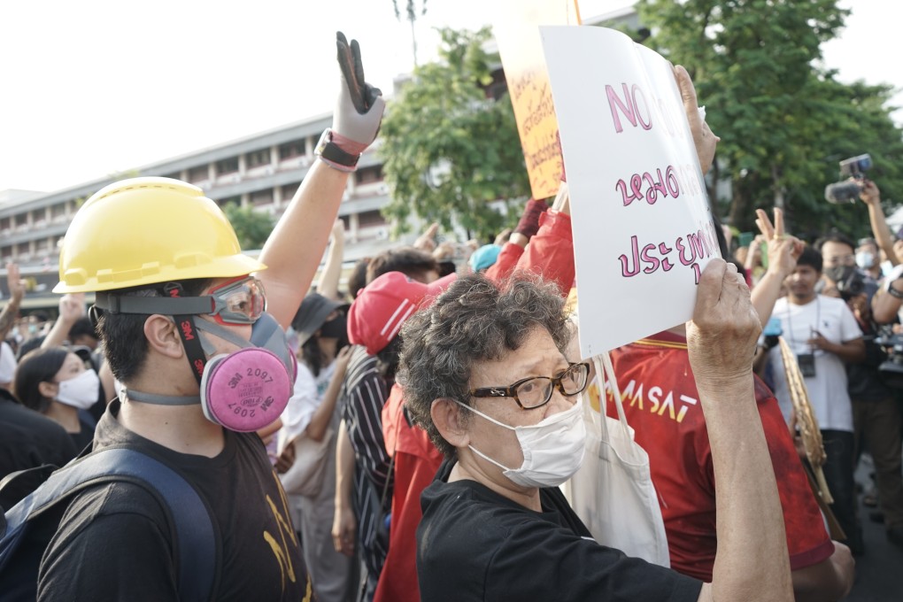 Thai protesters, some dressed in black and wearing hard helmets and gas masks, take part in an anti-government demonstration in Bangkok on July 18. Photo: Vijitra Duangdee