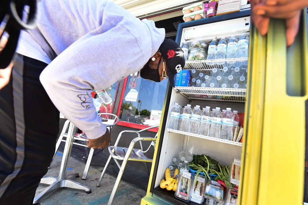 Restaurants, supermarkets, NGOs and neighbours chip in to keep the fridges filled. Photo: AFP