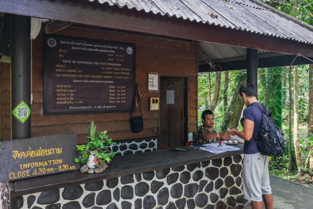 The bilingual ticket signage at the Khao Lak-Lam Ru National Park, in Phang Nga province, Thailand. Photo: Shutterstock