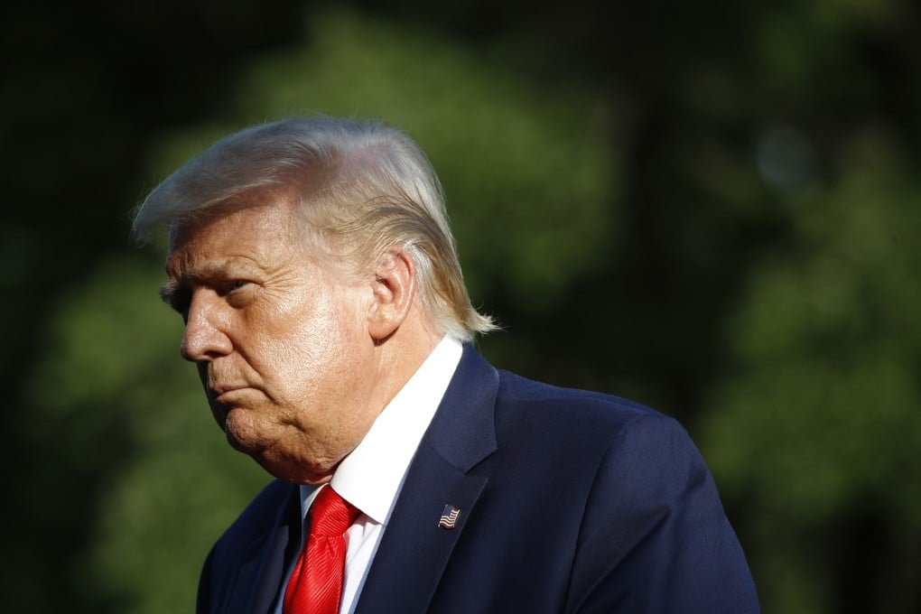 President Donald Trump walks on the South Lawn of the White House on July 15. Photo: AP