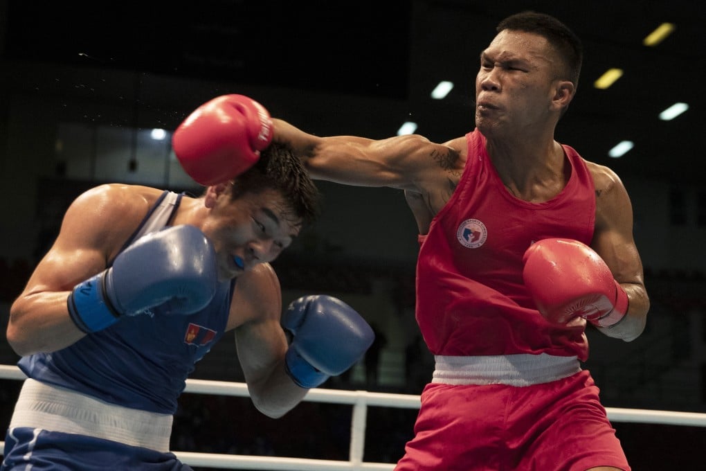 Eumir Felix Martial throws a right during his middleweight bout against Mongolia’s Byamba-Erdene Otgonbaatar at the Tokyo 2020 Olympic qualifiers in Amman, Jordan. Photo: EPA