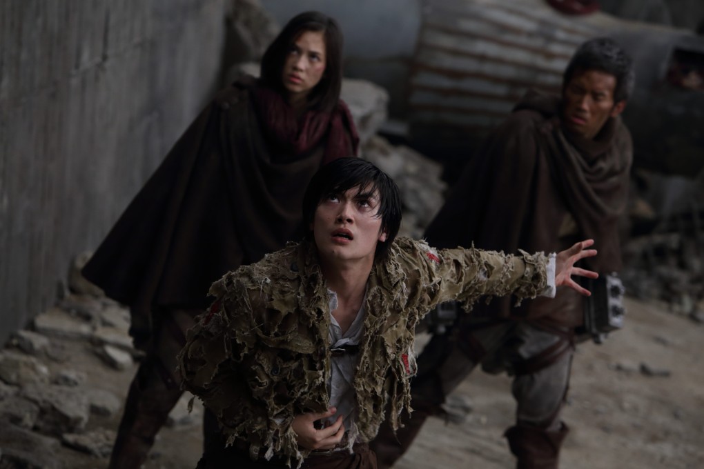 Haruma Miura (front) in a scene from Attack from Titan (2015). The versatile Japanese actor, who died at the age of 30, appeared in a number of notable films in lead and supporting roles, and performed on stage and in TV drama series.