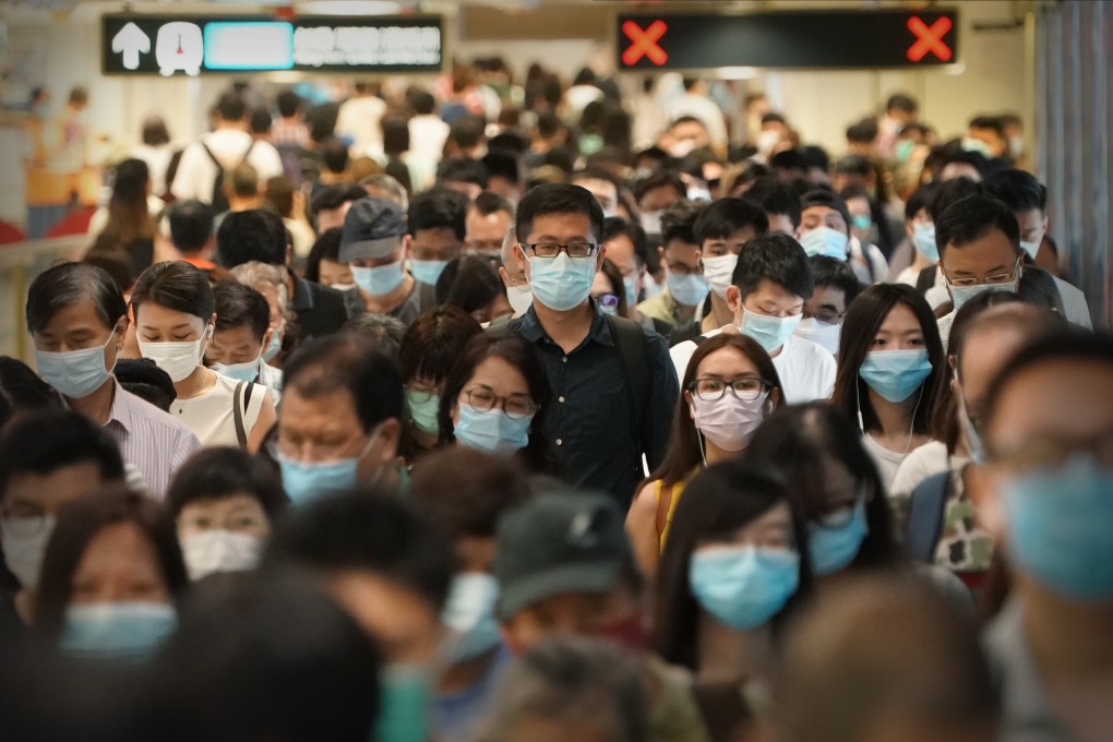 Commuters change platforms on the East Rail Line on July 14, amid the “third wave” of coronavirus infections in Hong Kong. Photo: SCMP / Felix Wong