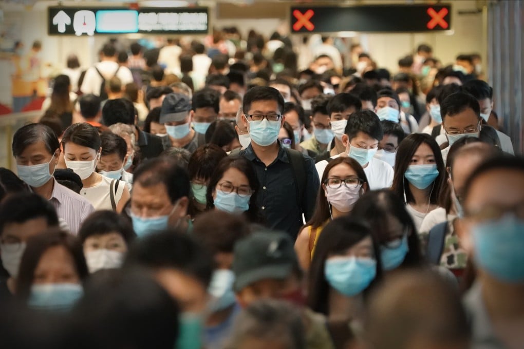 Commuters change platforms on the East Rail Line on July 14, amid the “third wave” of coronavirus infections in Hong Kong. Photo: SCMP / Felix Wong