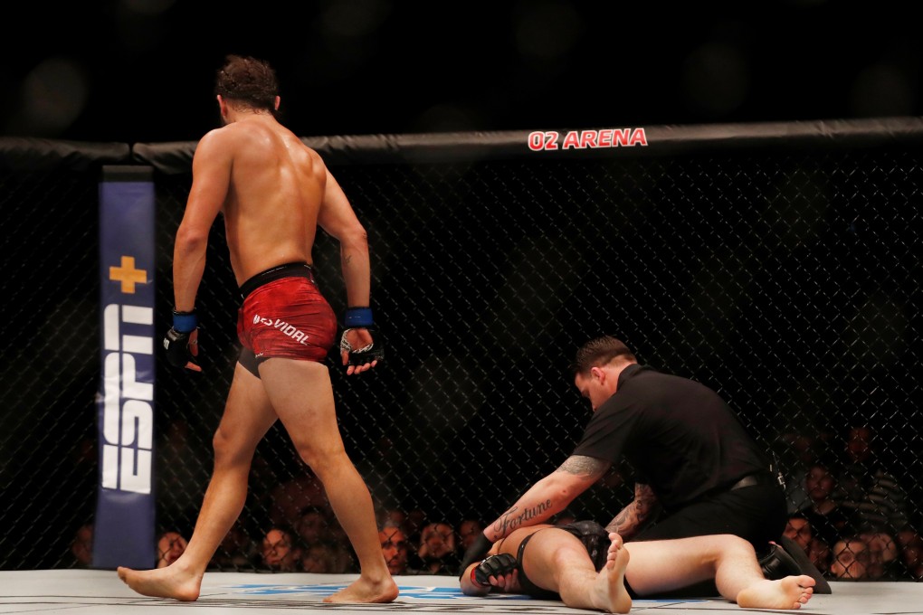 Darren Till receives medical attention after being knocked out by Jorge Masvidal. Photo: Reuters