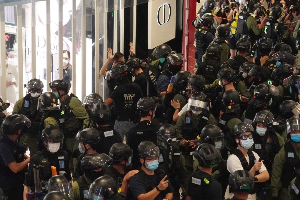 Riot police are seen during a protest marking the one year anniversary of the Yuen Long attack in YOHO Mall, Yuen Long, on Tuesday. Photo: Felix Wong