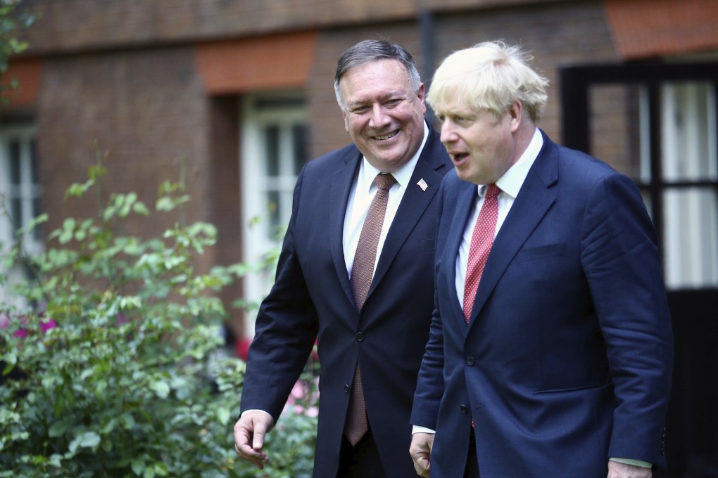 Britain’s Prime Minister Boris Johnson welcomes United States Secretary of State Mike Pompeo to Downing Street, London, on Tuesday. Photo: Pool via AP
