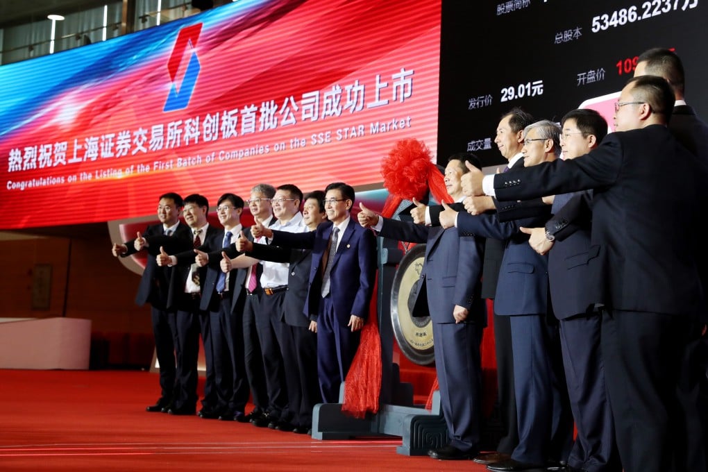 Executives from the first batch of Star Market debutants gather for a group picture to celebrate the inauguration in Shanghai on July 22, 2019. Photo: Xinhua