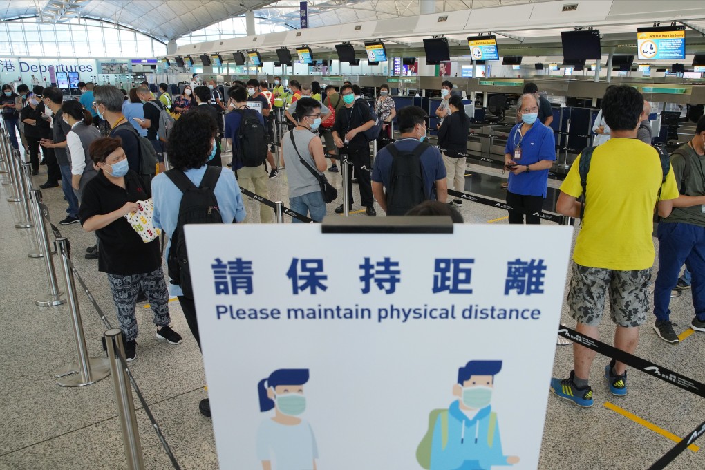 Staff at Hong Kong International Airport line up for coronavirus testing on Wednesday. Photo: Winson Wong