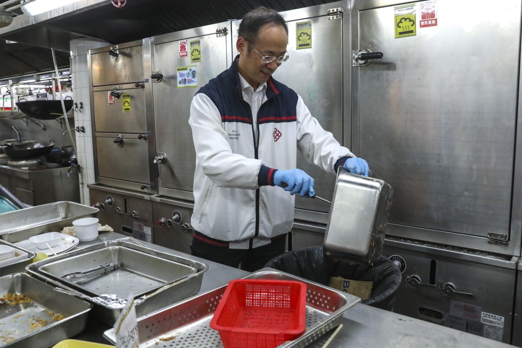 Alexander Wai helps to cleans a kitchen at PolyU, which was the centre of chaotic scenes during the city’s social unrest last year. Photo: Dickson Lee