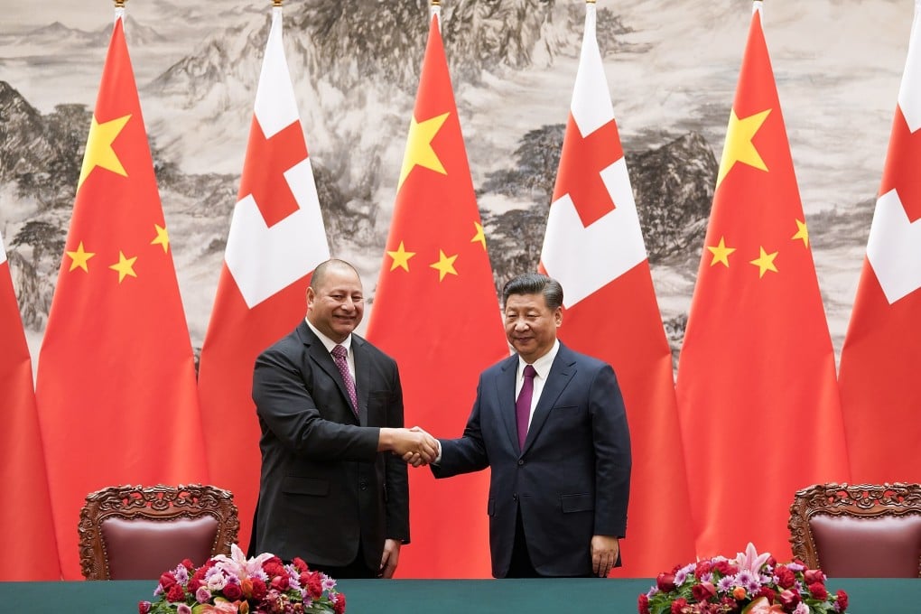 King Tupou VI of Tonga is welcomed by Chinese President Xi Jinping during a state visit, but the island nation is struggling to repay its loans. Photo: AFP