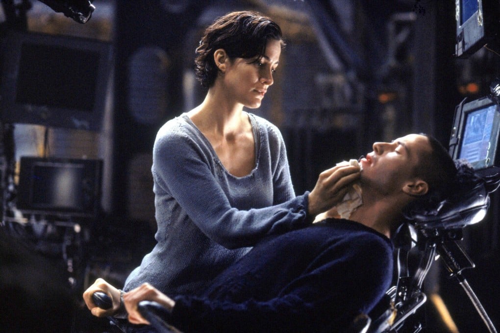 Carrie-Anne Moss (left) and Keanu Reeves star in The Matrix (1999). Its most prescient prediction is how, when given the red pill/blue pill choice, some people prefer to live entirely online. Photo: Courtesy Everett Collection