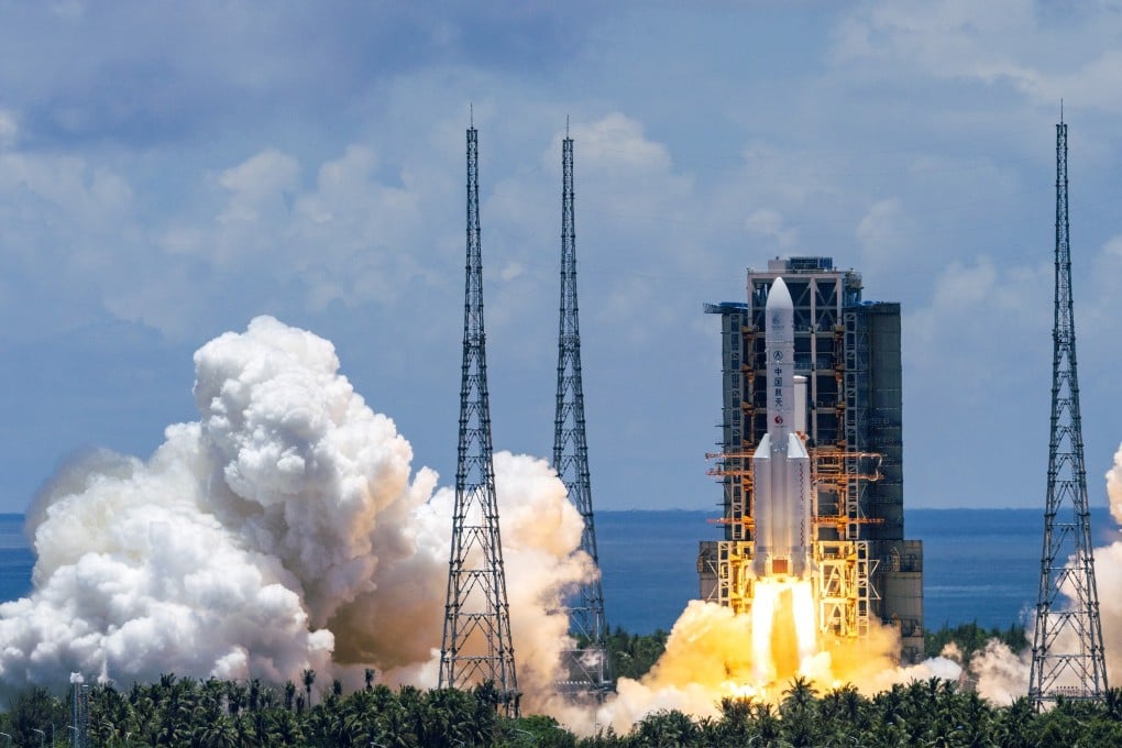 A Mars probe is launched on a Long March-5 rocket in southern Hainan province on Thursday. Photo: Xinhua