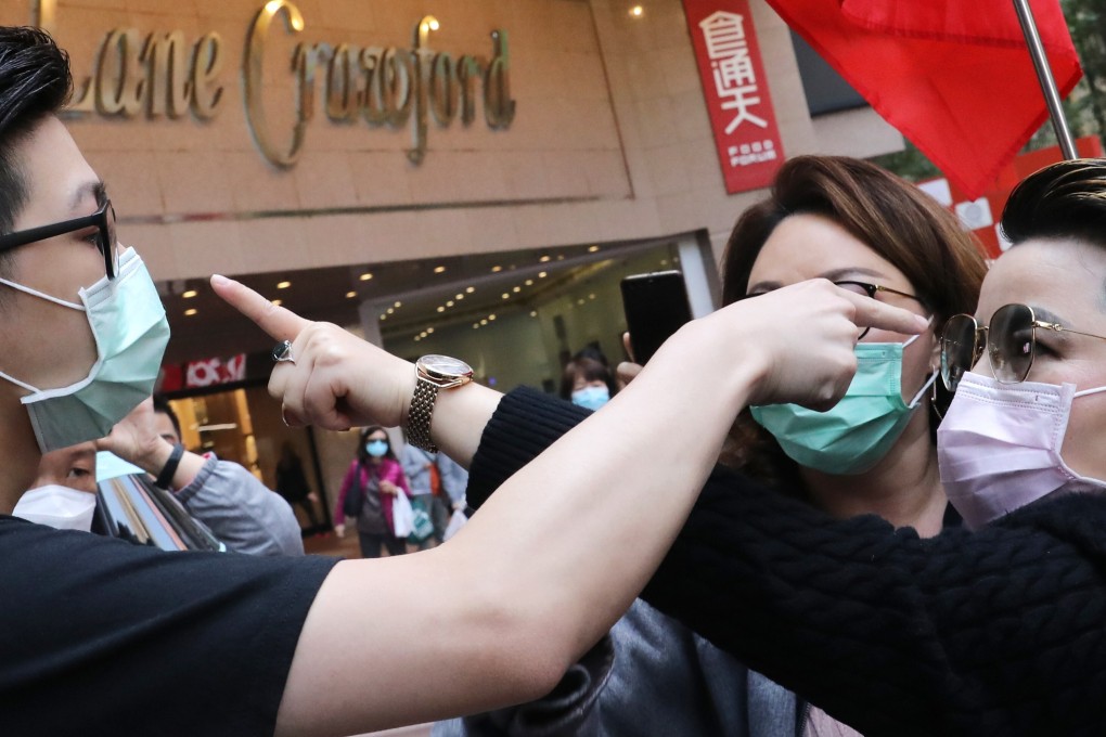 Pro-Beijing supporters clash with anti-government protesters at Times Square in Causeway Bay on February 20. The extradition bill protests, national security law, inequality, a perceived lack of opportunity and more have left Hong Kong society sharply divided. Photo: Dickson Lee