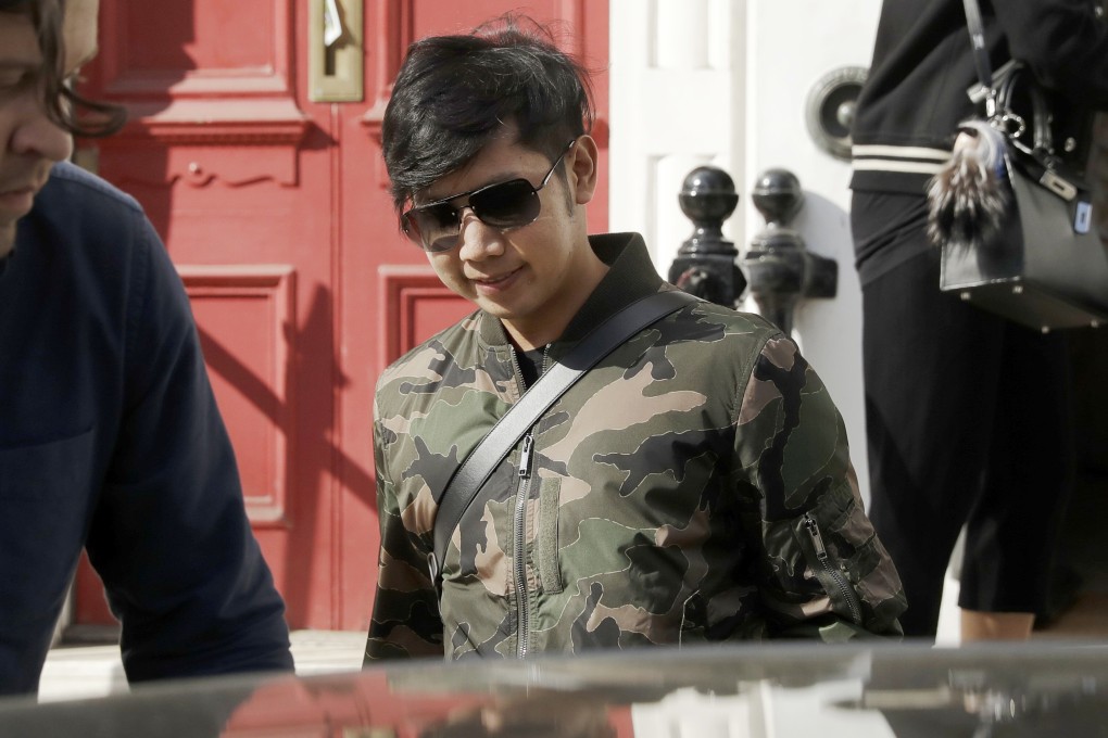 Red Bull heir Vorayuth “Boss” Yoovidhya walks to get in a car in London in April 2017. Photo: AP