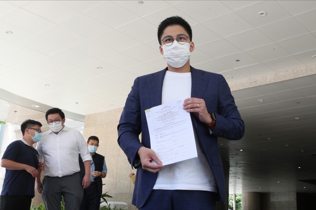 Kenneth Fok Kai-kong shows the nomination form for the Legislative Council general election on Thursday. Photo: Handout