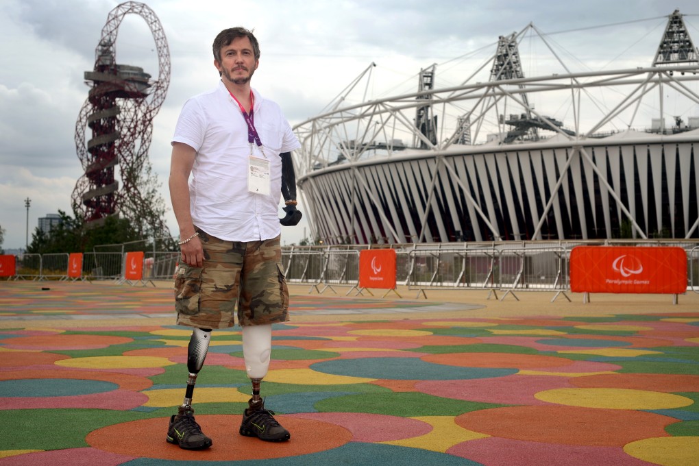 Photographer Giles Duley outside the Olympic Stadium in London. Duley lost three limbs after stepping on an improvised explosive device while covering the Afghanistan war in 2011. Photo: Getty Images