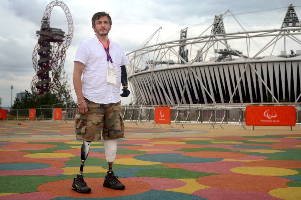 Photographer Giles Duley outside the Olympic Stadium in London. Duley lost three limbs after stepping on an improvised explosive device while covering the Afghanistan war in 2011. Photo: Getty Images