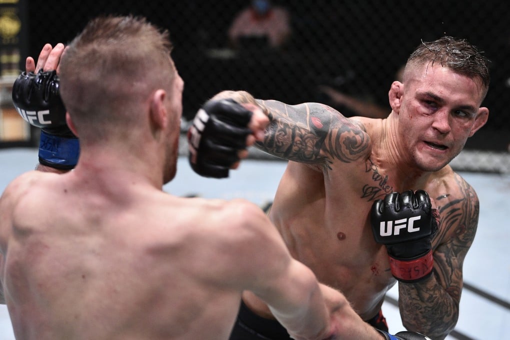 Dustin Poirier punches Dan Hooker during UFC Fight Night at the UFC APEX. Photo: Chris Unger/Zuffa LLC via USA TODAY Sports