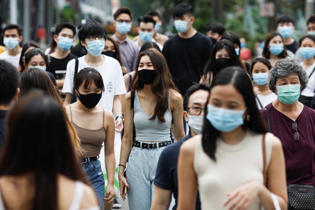 Pedestrians in the Orchard Road district of Singapore. Photo: Reuters