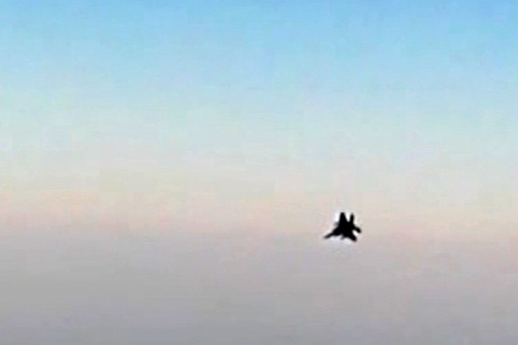 An image grab from a video released by state-run Iran Press news agency reportedly shows a fighter jet seen from an Iranian passenger plane after it was intercepted by a US F-15 while flying over Syria. Photo: AFP