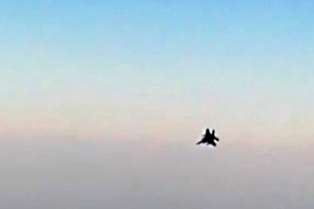 An image grab from a video released by state-run Iran Press news agency reportedly shows a fighter jet seen from an Iranian passenger plane after it was intercepted by a US F-15 while flying over Syria. Photo: AFP