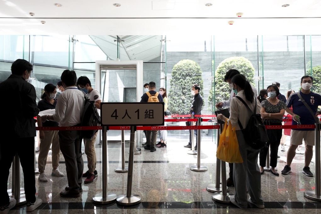 Potential home buyers line up at the sales office of Sun Hung Kai Properties (SHKP) to bid for 108 units of the Regency Bay project in Tuen Mun on 25 July 2020. Photo: Xiaomei Chen