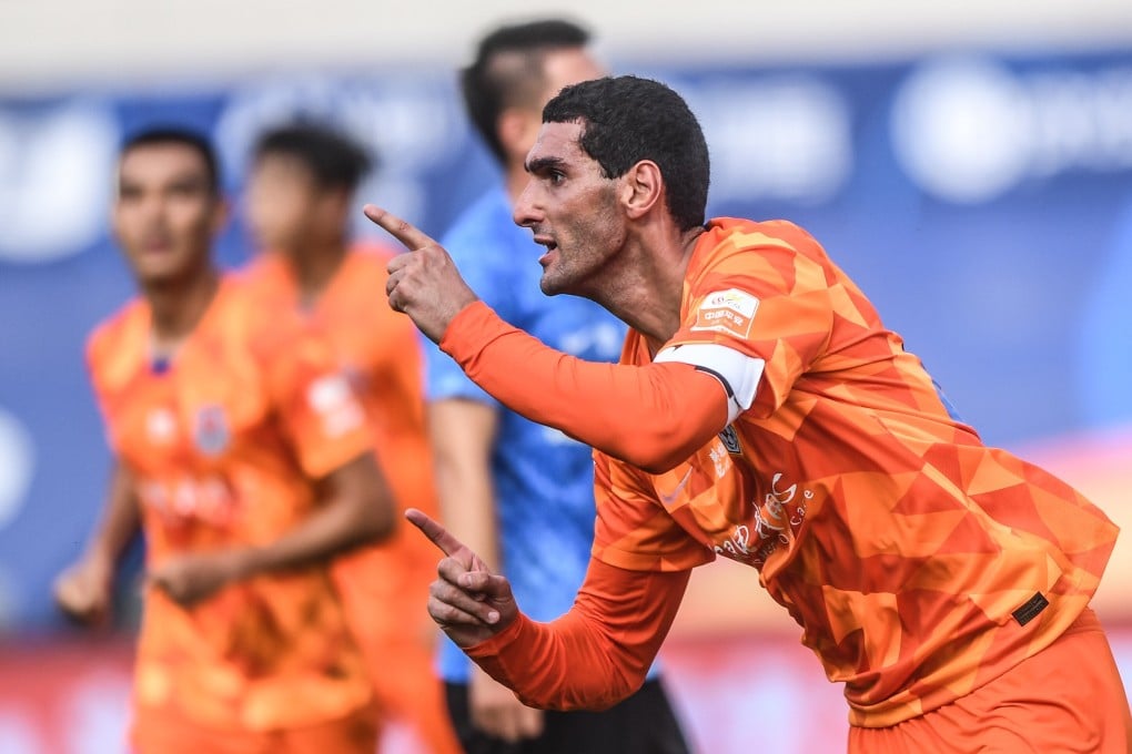 Marouane Fellaini of Shandong Luneng celebrates after scoring against Dalian Pro in Dalian. Photo: Xinhua