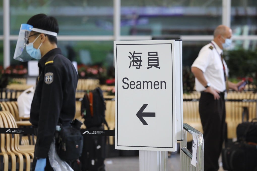 A sign directs incoming seamen at Hong Kong International Airport’s arrivals hall to Covid-19 testing at the nearby AsiaWorld-Expo. Dickson Lee
