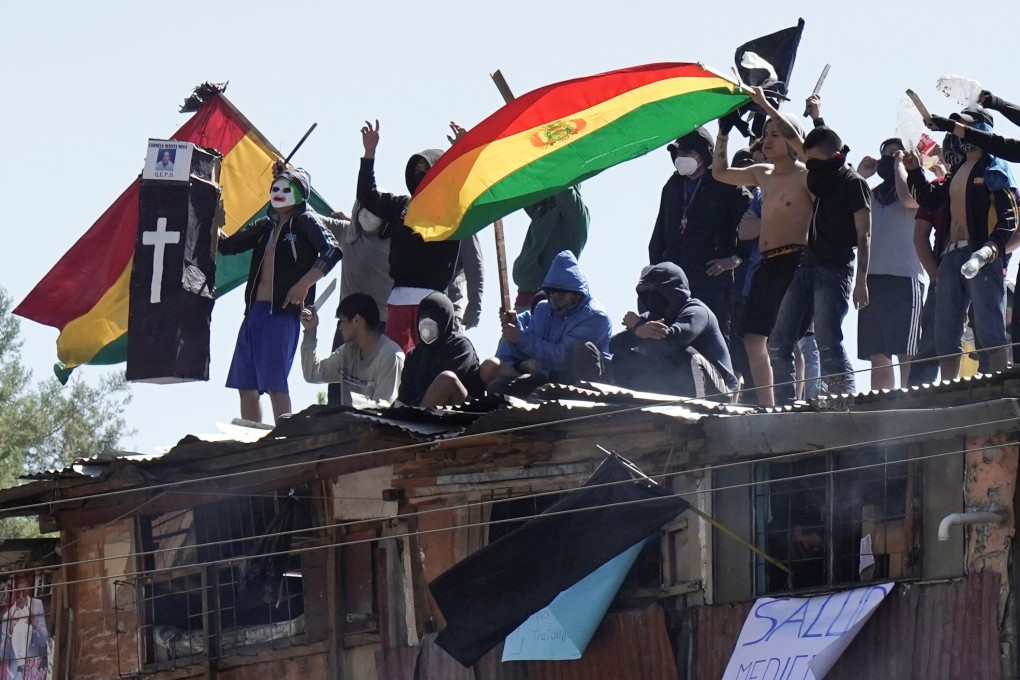 Inmates protest on the rooftop of the San Sebastian prison in Cochabamba, Bolivia on Monday. Photo: Reuters