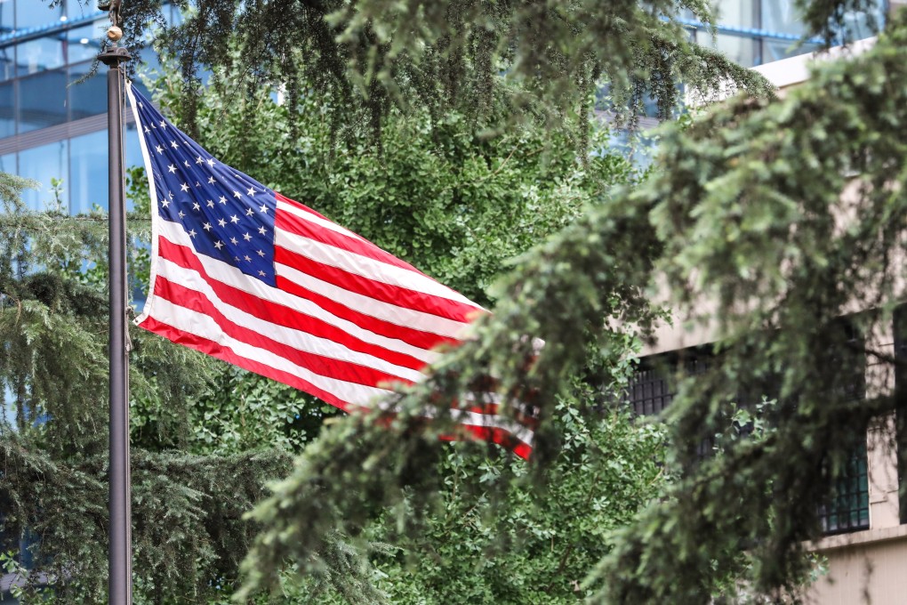 The US national flag at the Chengdu consulate was lowered for the final time on Monday morning. Photo: Simon Song
