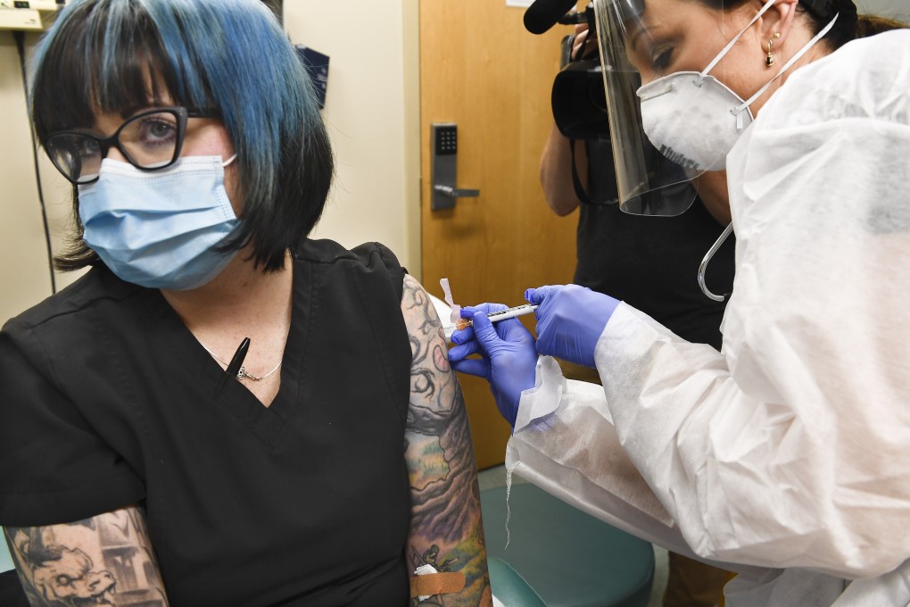 A nurse gives a volunteer an injection on Monday as the world's biggest study of a possible Covid-19 vaccine, developed by the US National Institutes of Health and Moderna, gets under way. Photo: AP