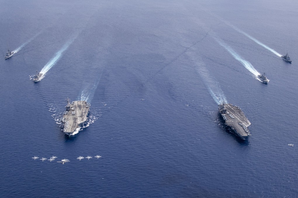 US Carrier Air Wings 5 and 17 fly in formation over the Nimitz Carrier Strike Force in the South China Sea in July 2020. Photo: EPA-EFE
