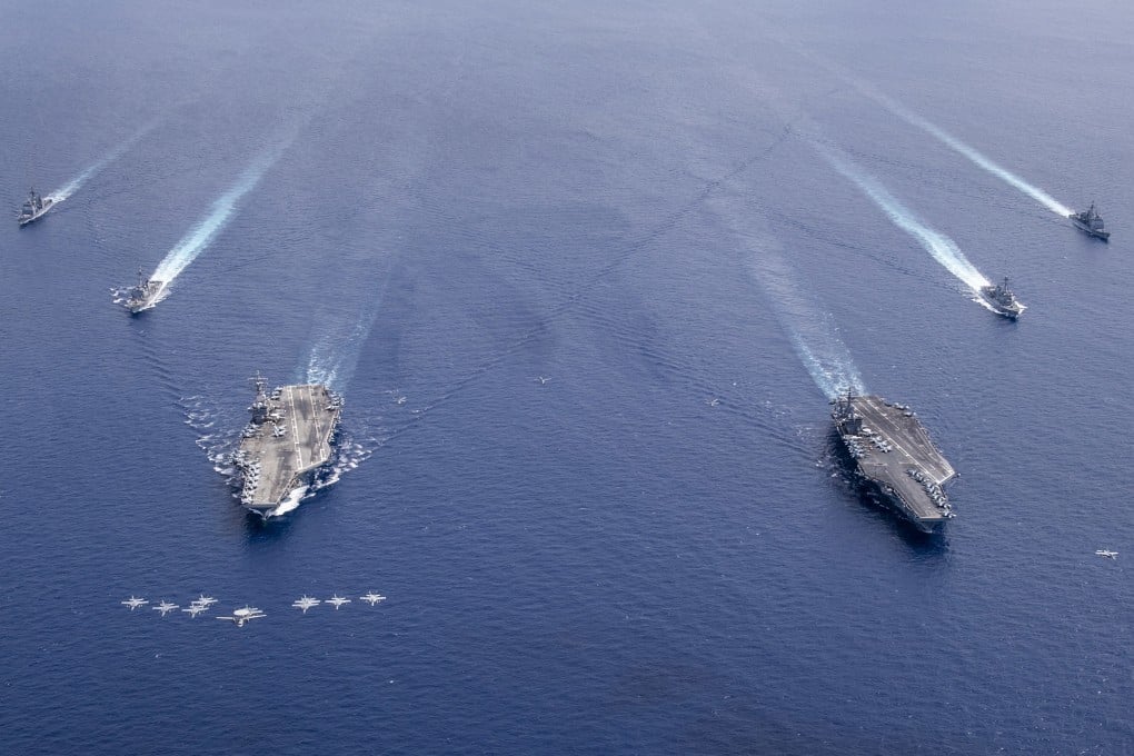 US Carrier Air Wings 5 and 17 fly in formation over the Nimitz Carrier Strike Force in the South China Sea in July 2020. Photo: EPA-EFE