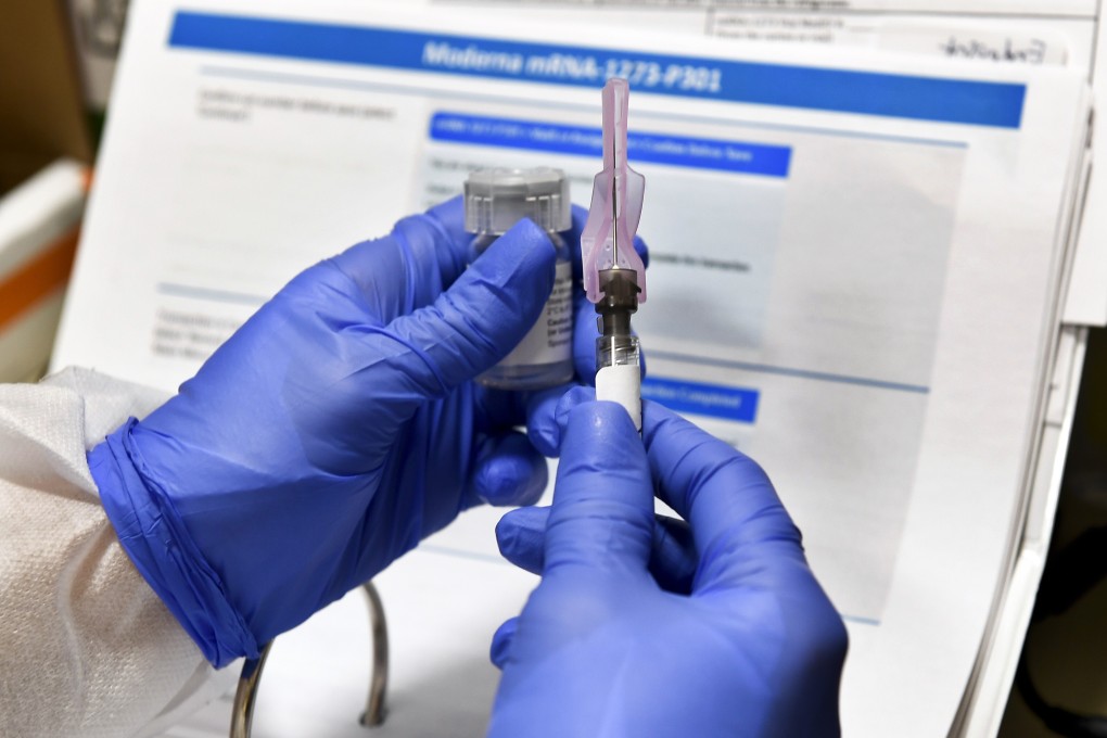 Nurse Kathe Olmstead prepares a shot as the world's biggest study of a possible COVID-19 vaccine, developed by the National Institutes of Health and Moderna, gets under way on Monday, in Binghamton, New York. Photo: AP Photo