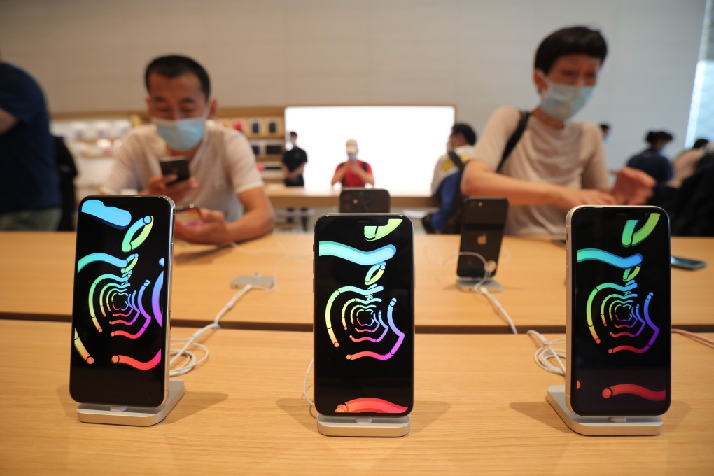Shoppers check out the latest iPhone models at the newly opened Apple Store in Sanlitun, Beijing, on July 17. Photo: Simon Song
