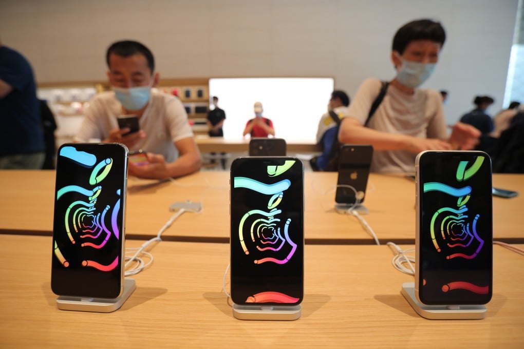 Shoppers check out the latest iPhone models at the newly opened Apple Store in Sanlitun, Beijing, on July 17. Photo: Simon Song