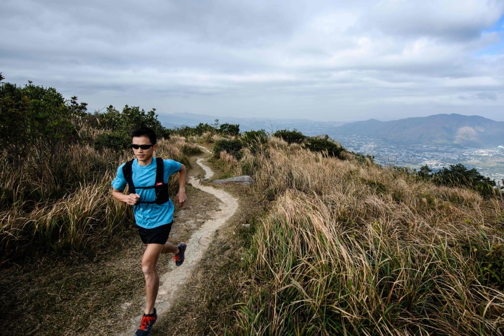 Stone Tsang Siu-keung knows a mask will make running uncomfortable but hopes people will comply. Photo: Agence France-Presse