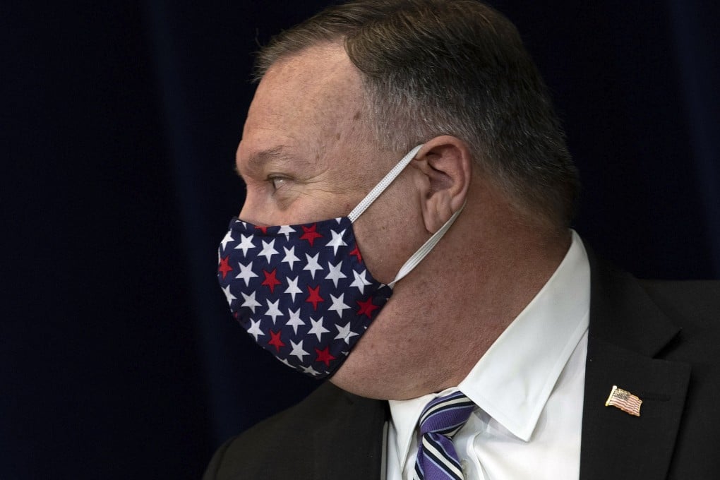 Secretary of State Mike Pompeo wears a face mask as he leaves after a news conference at the State Department in Washington on Tuesday. Photo: AP
