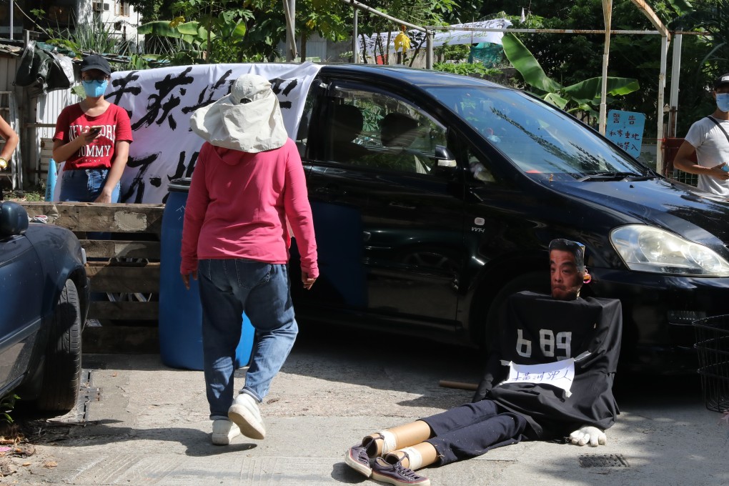 Villagers protesting against the eviction from their homes in Wang Chau. Photo: K. Y. Cheng