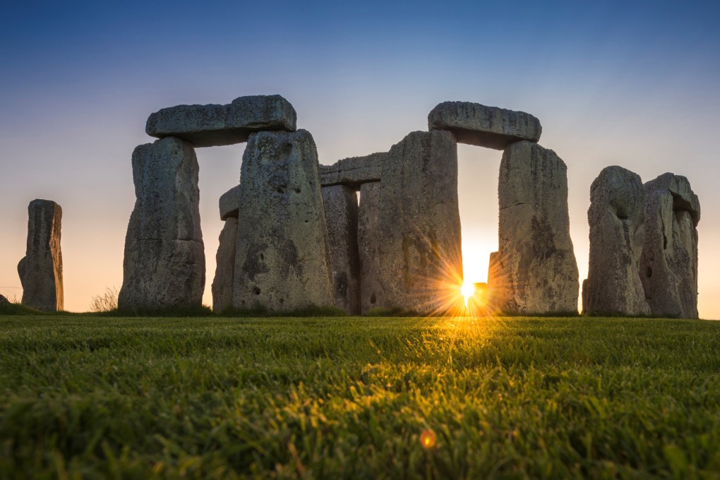 The Stonehenge stone circle during the sunset, near Amesbury, Britain. Photo: English Heritage/A. Pattenden handout via Reuters