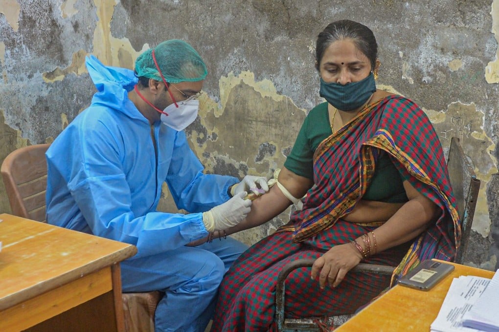 A woman who recovered from the Covid-19 disease donates blood plasma in Dharavi on July 23, 2020. Photo: AFP