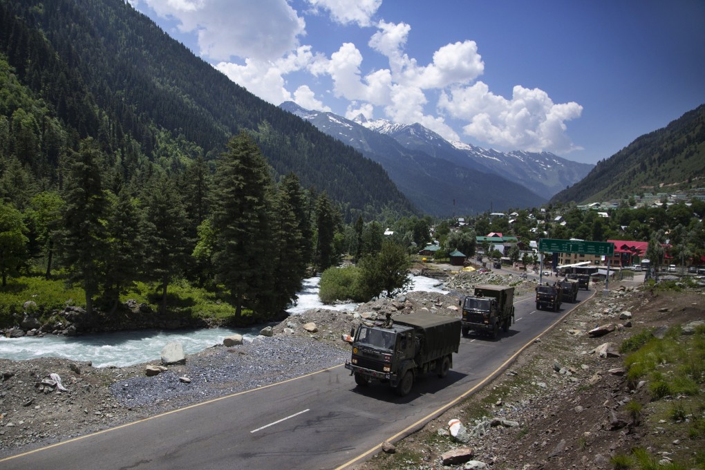An Indian army convoy moves on the Srinagar-Ladakh highway. Photo: AP