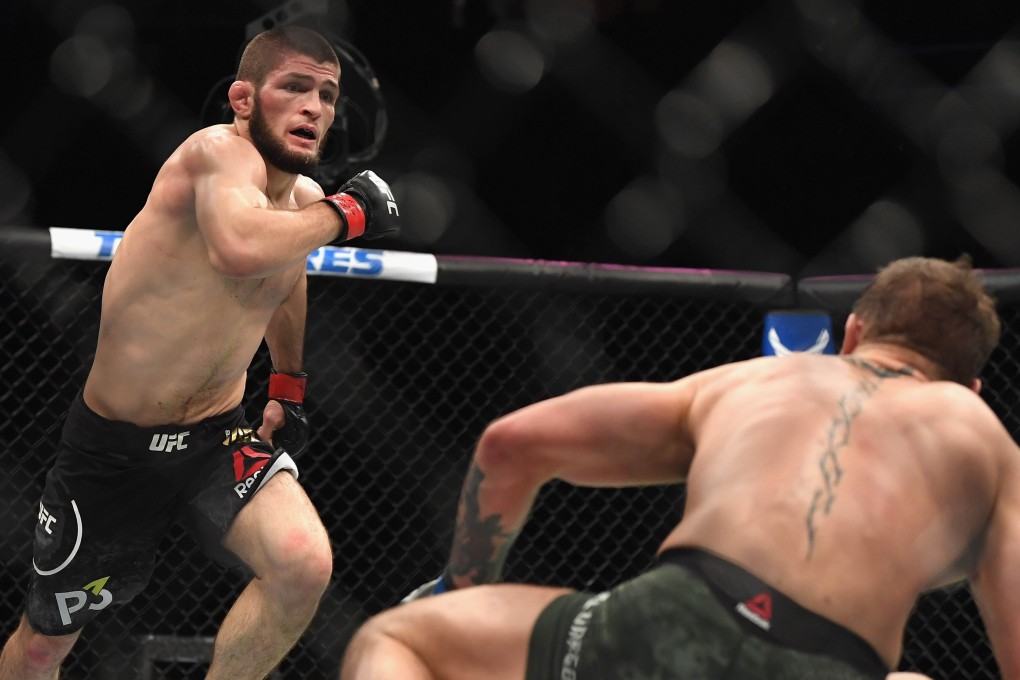 Khabib Nurmagomedov chases down Conor McGregor in their lightweight championship bout during UFC 229. Photo: AFP