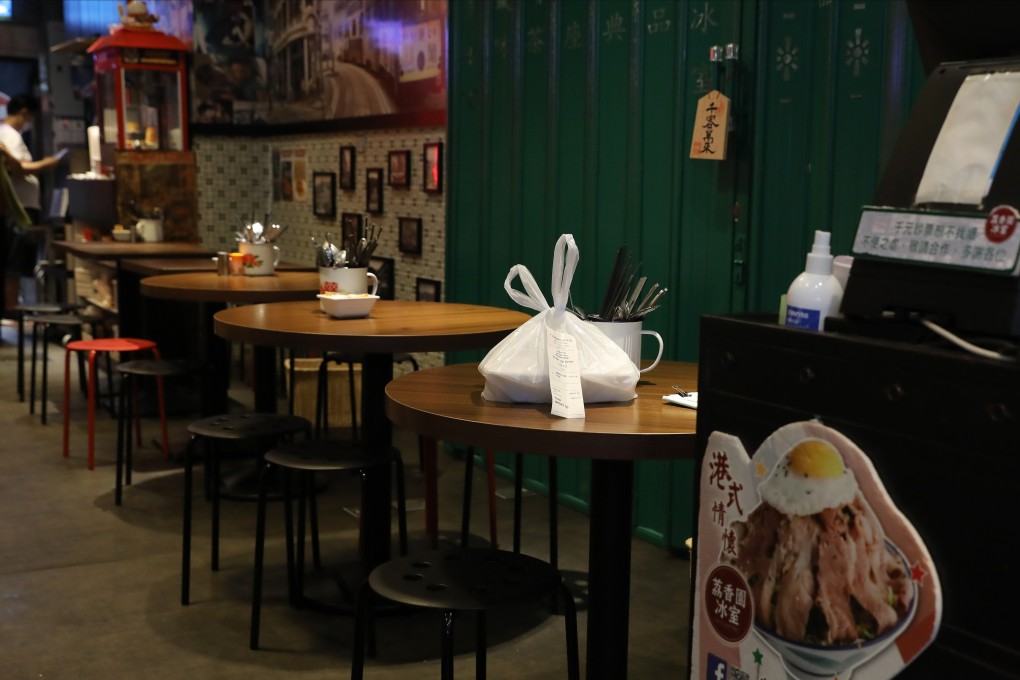A takeaway dinner seen waiting on a table at a restaurant in Mong Kok. Amid the ‘third wave’ of coronavirus infections, stricter restrictions have been imposed to reduce social contact. Photo: K.Y. Cheng